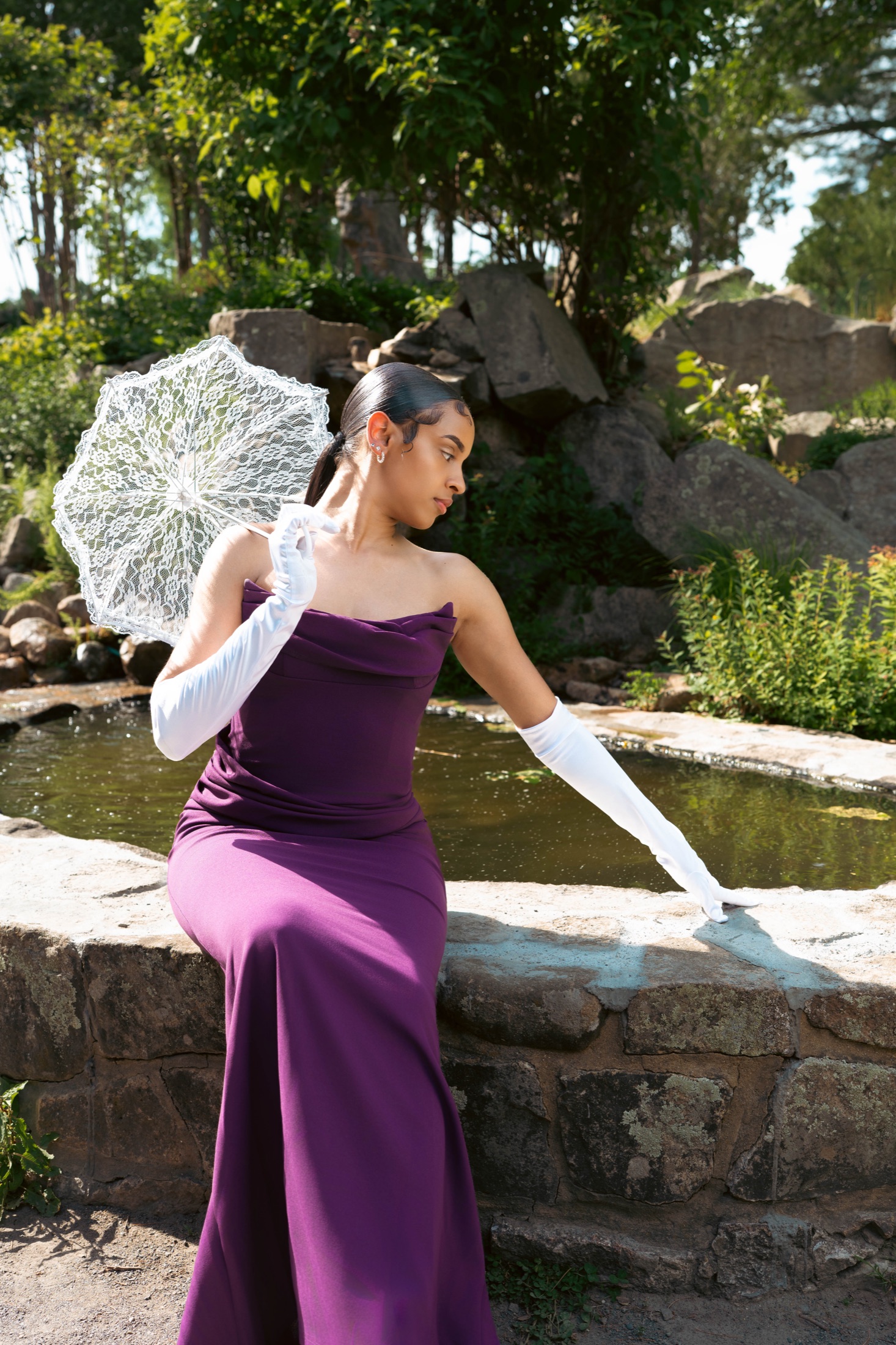 Outdoor editorial portrait in a purple dress